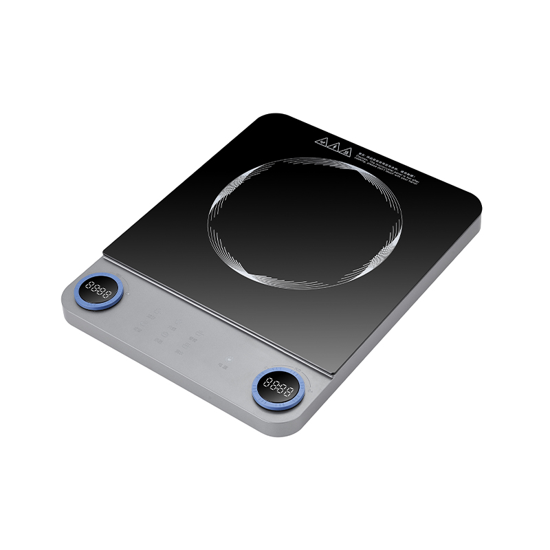 What specific safety features are typically integrated into commercial induction cookers?